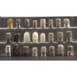 Twenty four thimbles, mostly damaged, comprising an 18th Century filigree example, nine hall