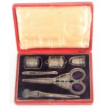 An early 19th Century six piece silver sewing set in the style of Joseph Taylor, the red leather