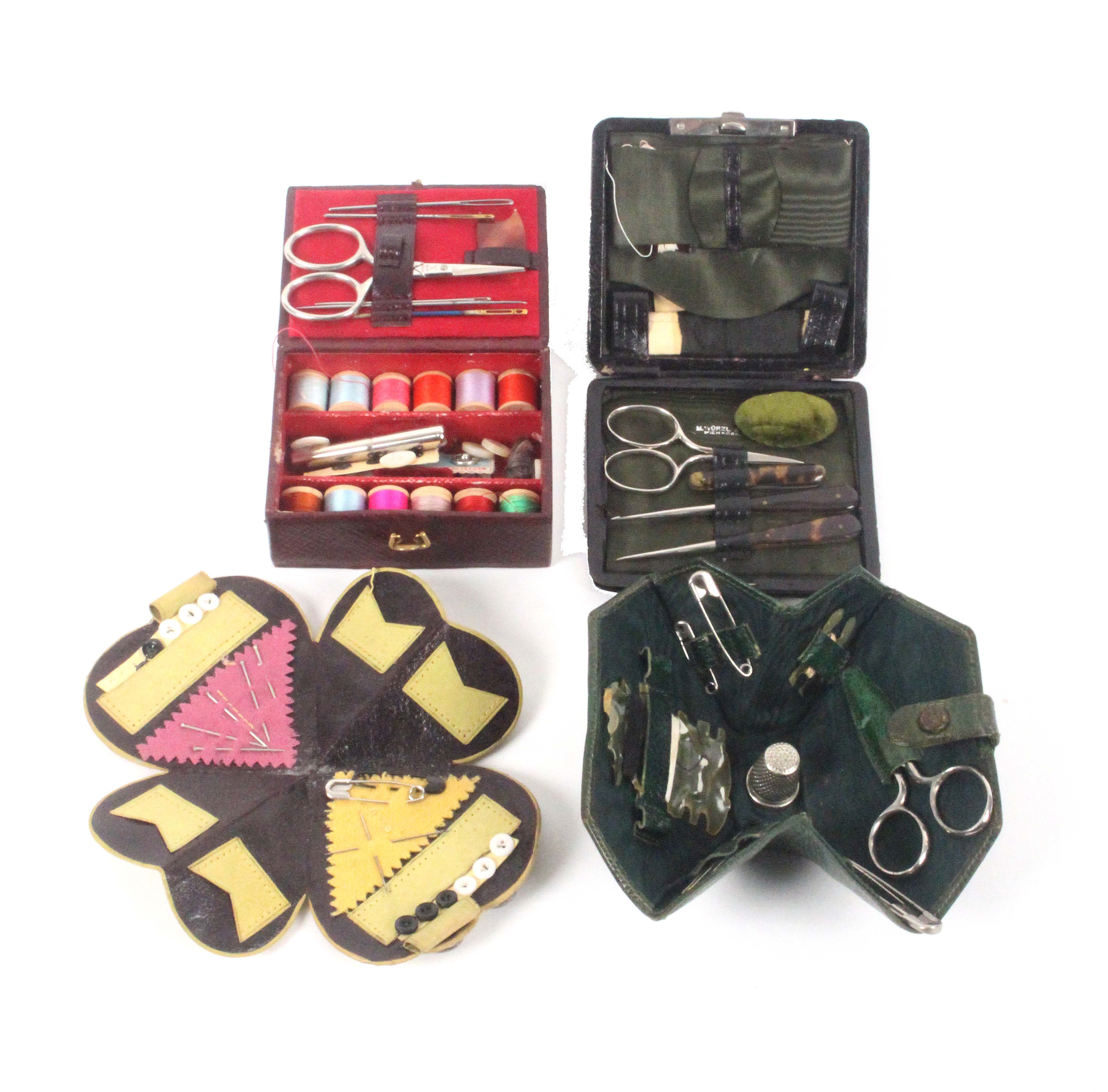 Four small leather sewing companions, each with a selection of tools and accessories, largest 9cms. - Image 2 of 2