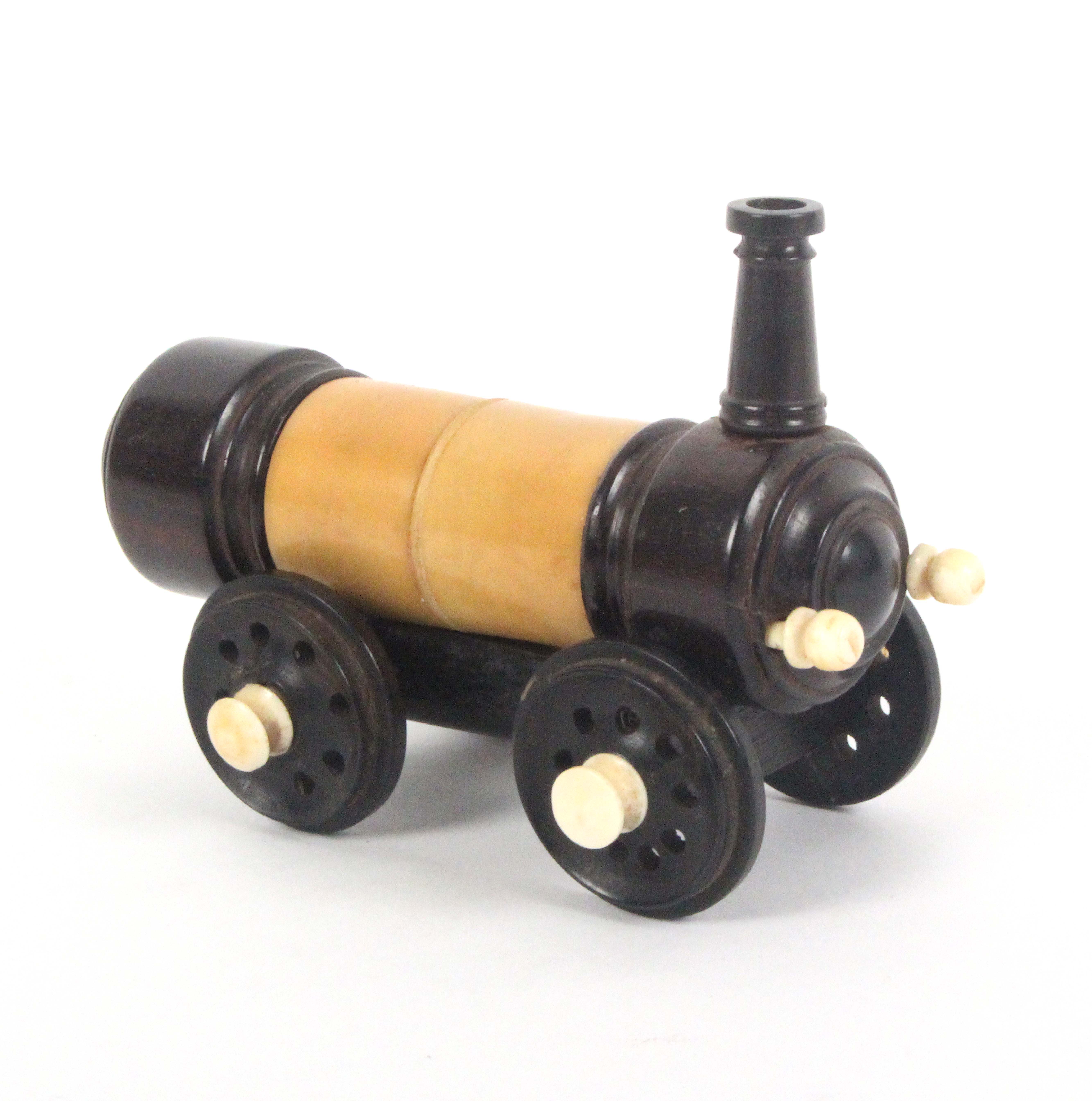 A rare crochet set contained in a model of a steam locomotive, in vegetable ivory, rosewood and