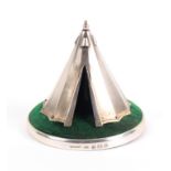 A rare silver pin cushion and hat pin stand in the form of a military bell tent, on green velvet