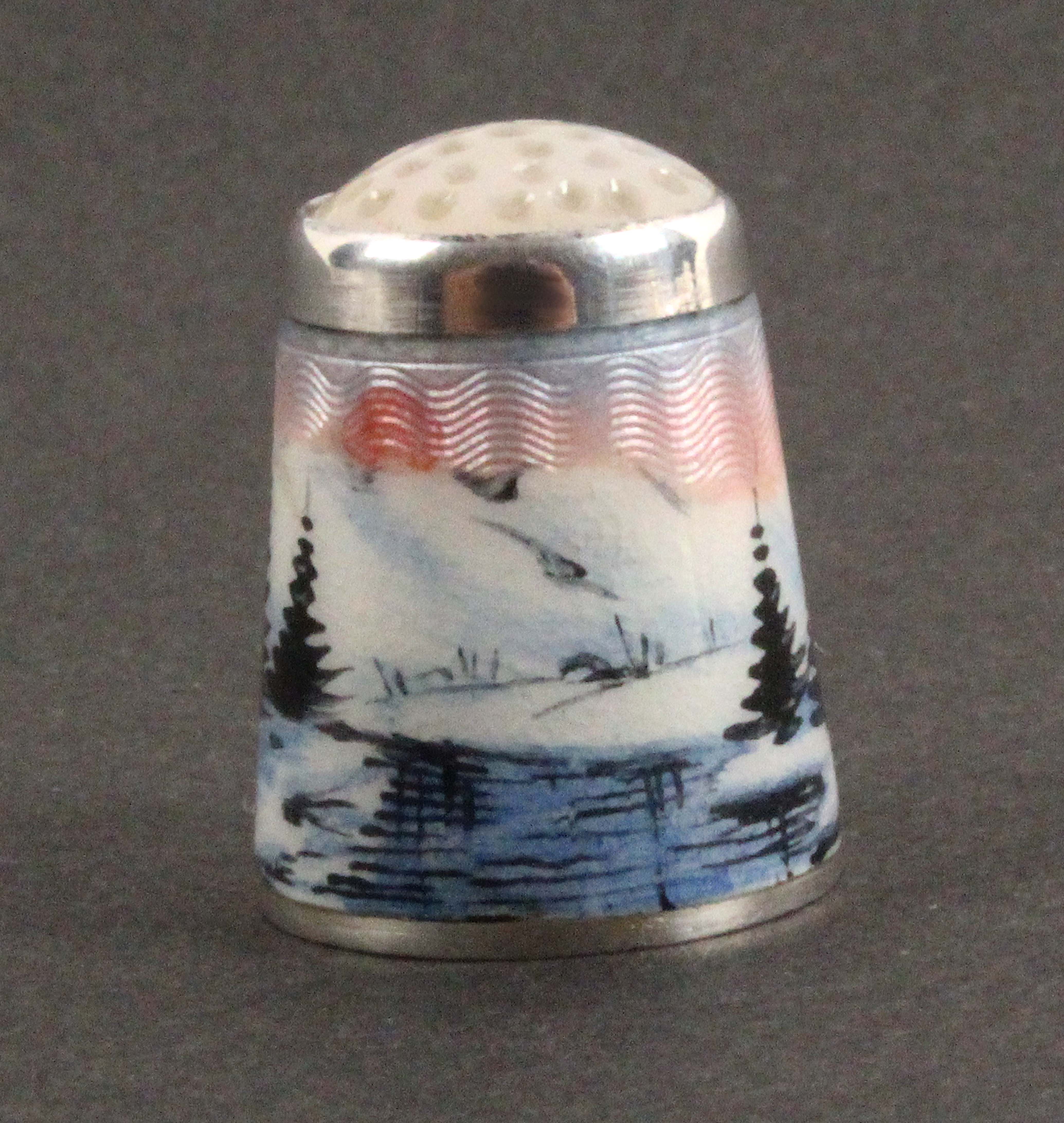 A Norwegian silver and enamel thimble, depicting a river, pine trees, in a snowy mountainous - Image 2 of 2