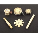 Six 19th Century Anglo-Indian ivory sewing tools, with burnt circle decoration comprising a cylinder