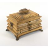 An unusual gilt tooled vellum covered sewing box, circa 1820, of complex sarcophagal form with fan