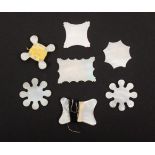 Seven mother of pearl thread winders, including three Chinese engraved snowflake examples, largest