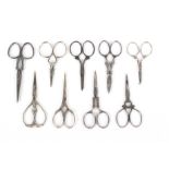 Nine pairs of 19th Century and later steel scissors, all with decorative arms or loops including a