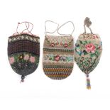 Three 19th Century beadwork draw string bags, all with floral and geometric decoration, largest