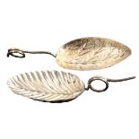 Two silver caddy spoons, both with oval leaf decorated bowl with wire work encircled handle, one