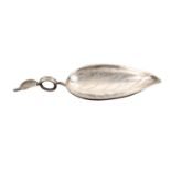 A silver caddy spoon, the leaf shaped bowl appropriately dot engraved, the wire encircled handle