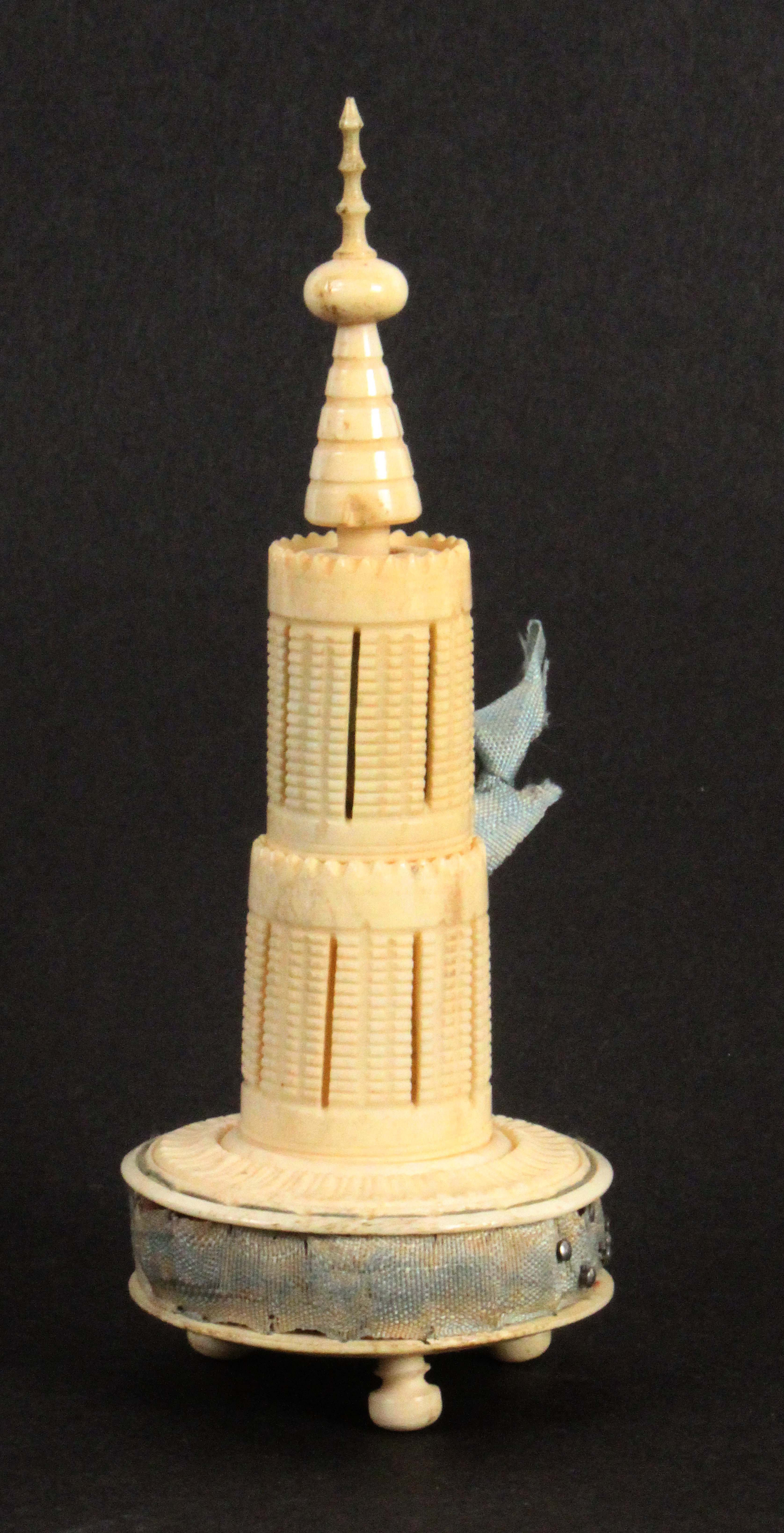 An early 19th Century turned ivory sewing tower, the circular base on three ball feet and fitted - Image 2 of 3