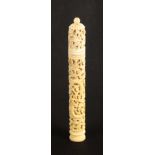 An early 19th Century carved ivory Chinese cylinder netting case, carved with dragon, birds,
