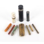 Ten various needle cases, including an engraved oval section brass example with hinged cover, 8.
