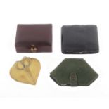 Four small leather sewing companions, each with a selection of tools and accessories, largest 9cms.