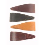 Four leather triangular form scissor cases, three containing three pairs of scissors, one with two