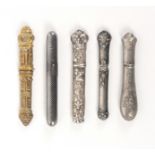 Five continental needle cases, comprising a French silver cylinder example with niello decoration,
