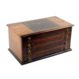 A four drawer walnut counter reel chest, the top with printed label for 'C.A. Rickards Machine