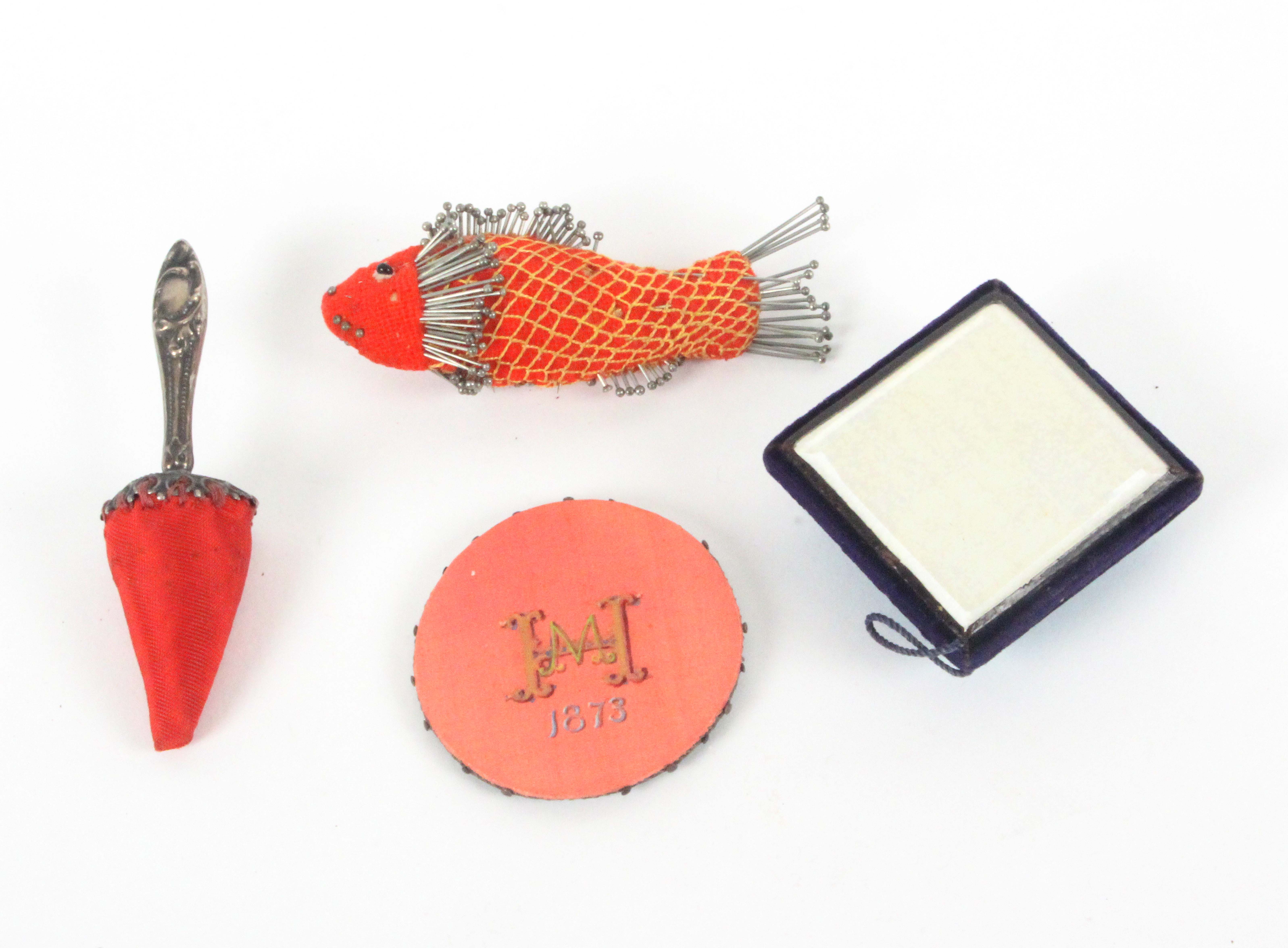 Four pin cushions, comprising a red material example pin stuck as a fish, a little moth, 8.5cms, - Image 2 of 2