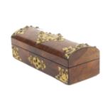 A mid Victorian figured walnut and brass mounted sewing box, the front and domed lid applied with