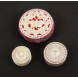 A mother of pearl pin cushion, an emery and a waxer, all of disc form the pin cushion pierced and