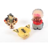 Three novelty celluloid tape measures, comprising a child dressed as a native American Indian, 6.