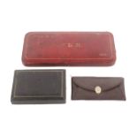 Three sewing companions, comprising a red leather rectangular example the lid initialled and dated