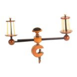 A boxwood, rosewood and bone winding clamp, the birdcage reels with turned tops and bases with