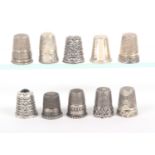 Ten 19th Century and later continental silver thimbles, including one with frieze inscribed 'Gott