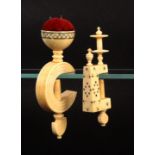 Two 19th Century ivory sewing clamps, both with burnt circle decoration, one with rectangular