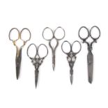 Five pairs of 19th Century steel scissors, including a pair with gilded arms stamped 'Brookes and