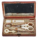 A small Palais Royal sewing companion, circa 1820, the rectangular case in grained red morocco