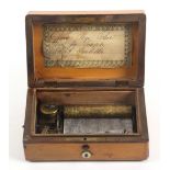 A French 19th Century musical box, the rectangular satinwood box with burr mulberry inlaid lid,