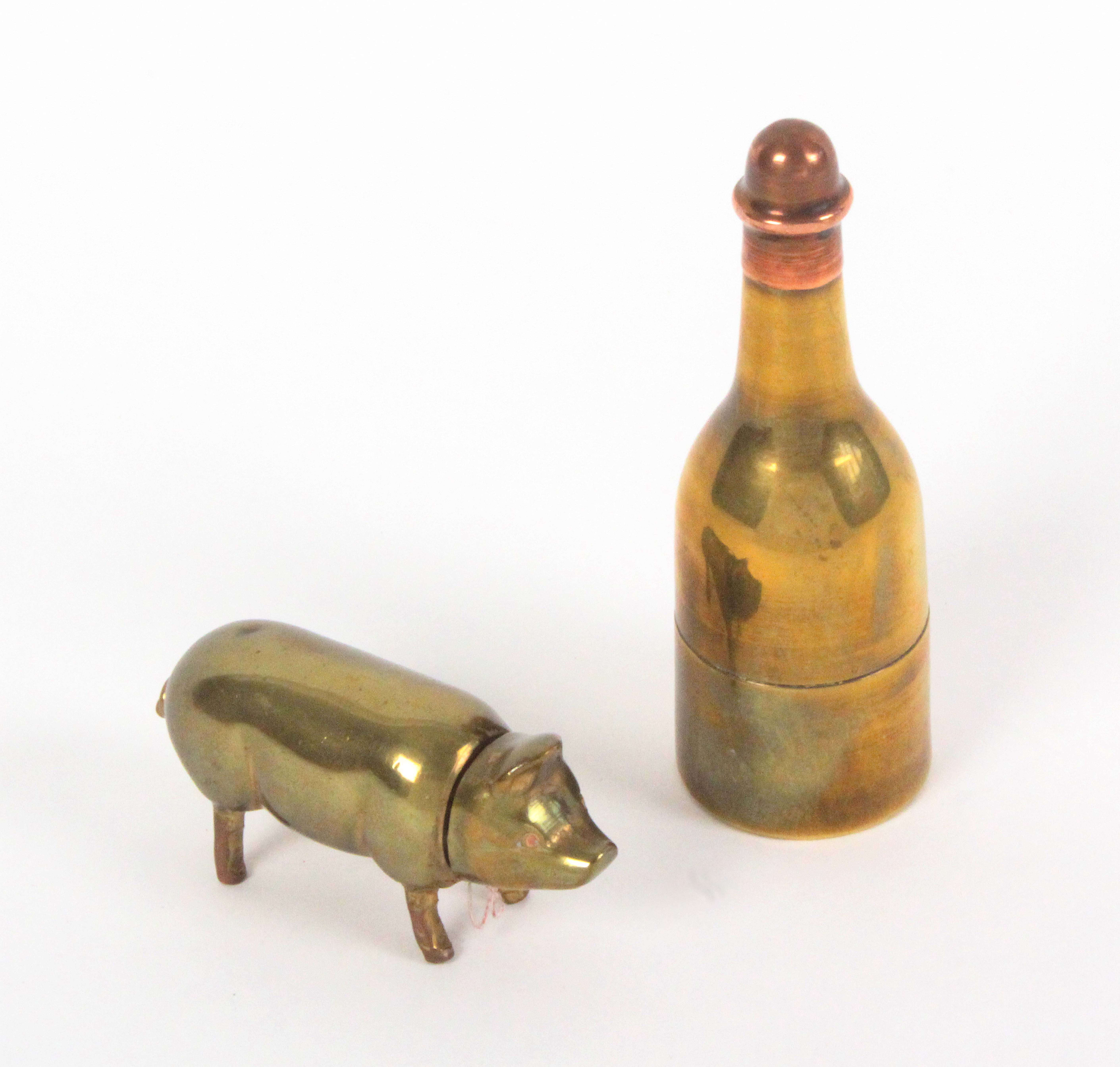 Two brass novelty sewing companions, comprising a bottle with copper cover fitted as a thimble and