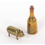 Two brass novelty sewing companions, comprising a bottle with copper cover fitted as a thimble and