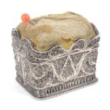 A late 18th Century silver filigree pin cushion, of rectangular form, the sides and base in