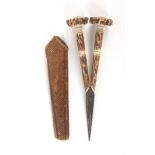 An unusual pair of stag horn handled scissors, oval section tapering steel blades to carved and