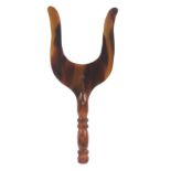 A rare 19th Century tortoiseshell lucet, of usual lyre form on a turned tortoiseshell handle, 10.