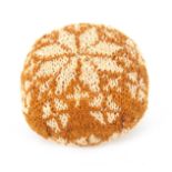 A late 18th Century/early 19th Century knitted pin 'ball', of near square form worked with a