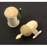 Two 19th Century ivory tape measures, comprising a cylinder example with floral carved top, the