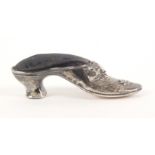 A silver pin cushion in the form of a lady's shoe, with bow and flower to toe cap, blue velvet