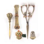 A fine set of five engraved silver gilt sewing tools, four coral mounted, comprising a waisted