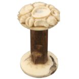 An unusual 19th Century bone, wood and ivory reel, the domed top in ivory and intricately carved
