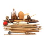 A collection of wooden items, mostly sewing related, including a reel stand, darners, yarn