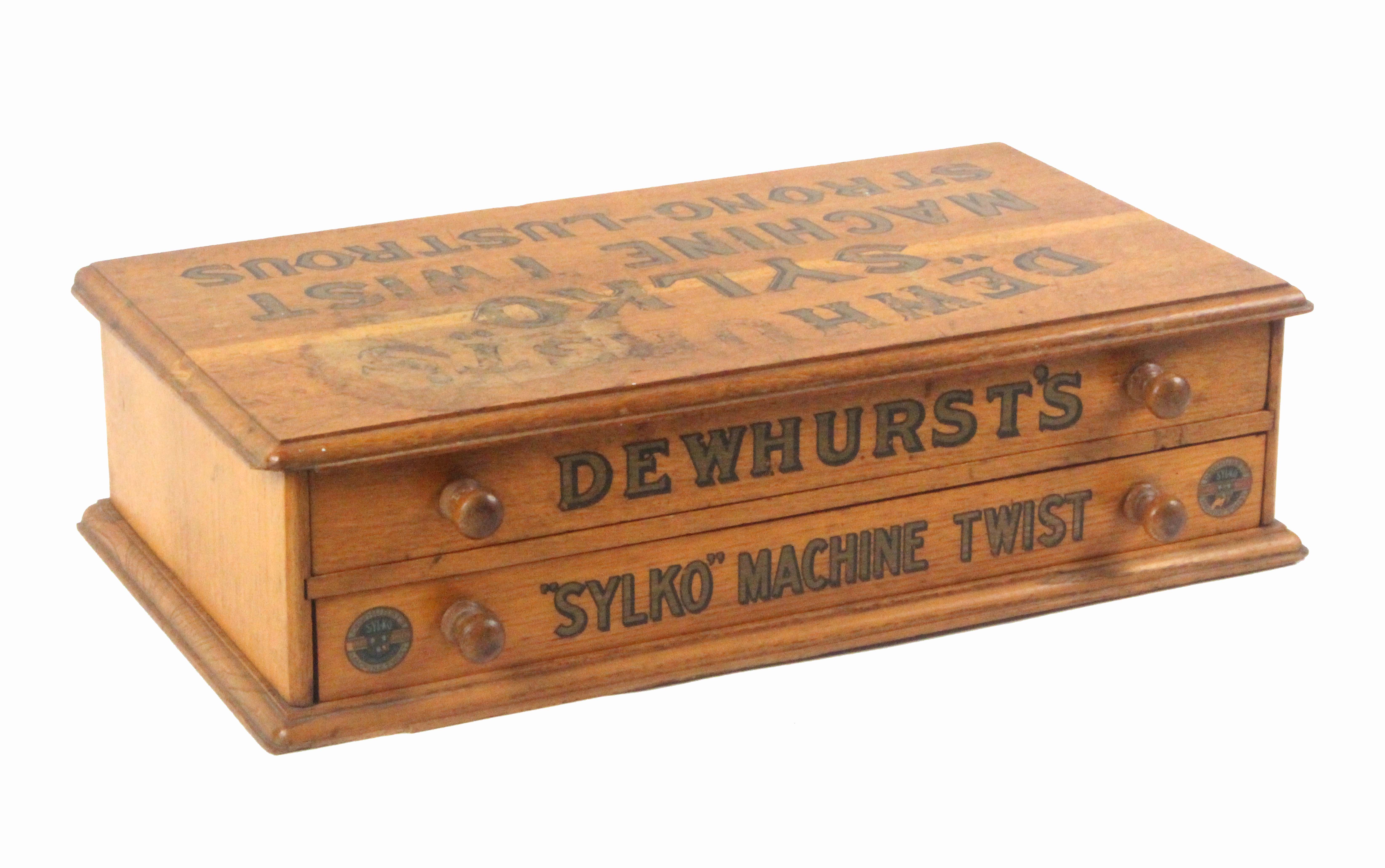 An oak counter reel chest, of two drawers inscribed to the top in black and gilt 'Dewhurst's Sylko