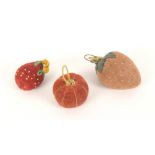 Three emeries, comprising a velvet strawberry with loop mount, 6.5cms, another knitted and