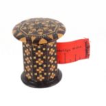 A good rosewood Tunbridge ware tape measure by Edmund Nye, the octagonal body in geometric mosaic