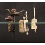 Three sewing clamps, comprising a brass hemming bird, the rectangular floral frame with pin cushion,
