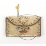 An 18th Century English ivory silk purse or wallet, of envelope form brightly embroidered in silks
