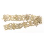 A length of 17th/18th Century Venetian gros point gold thread lace, formed as flowers within