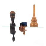 Two wooden sewing clamps and a glove powderer, comprising a boxwood cylinder form example with
