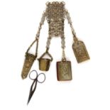 A nickel plated late Victorian brass chatelaine, the hook with three elaborately pierced panels with